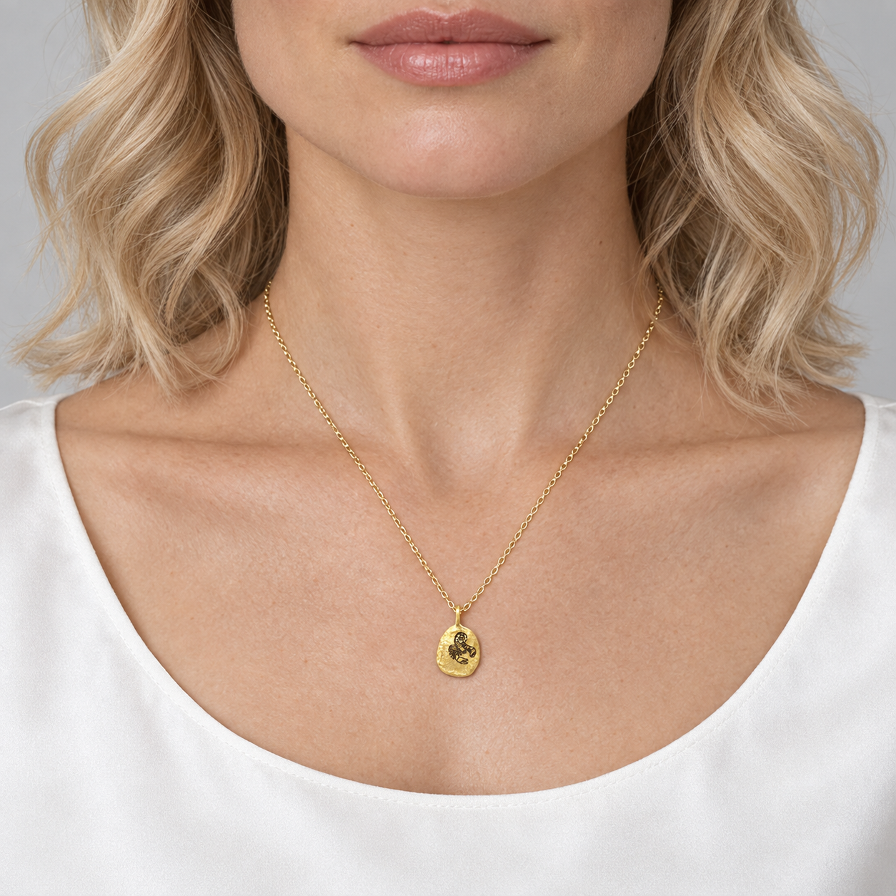Model wearing the Lesunja Zodiac Scorpio Yellow Gold Necklace