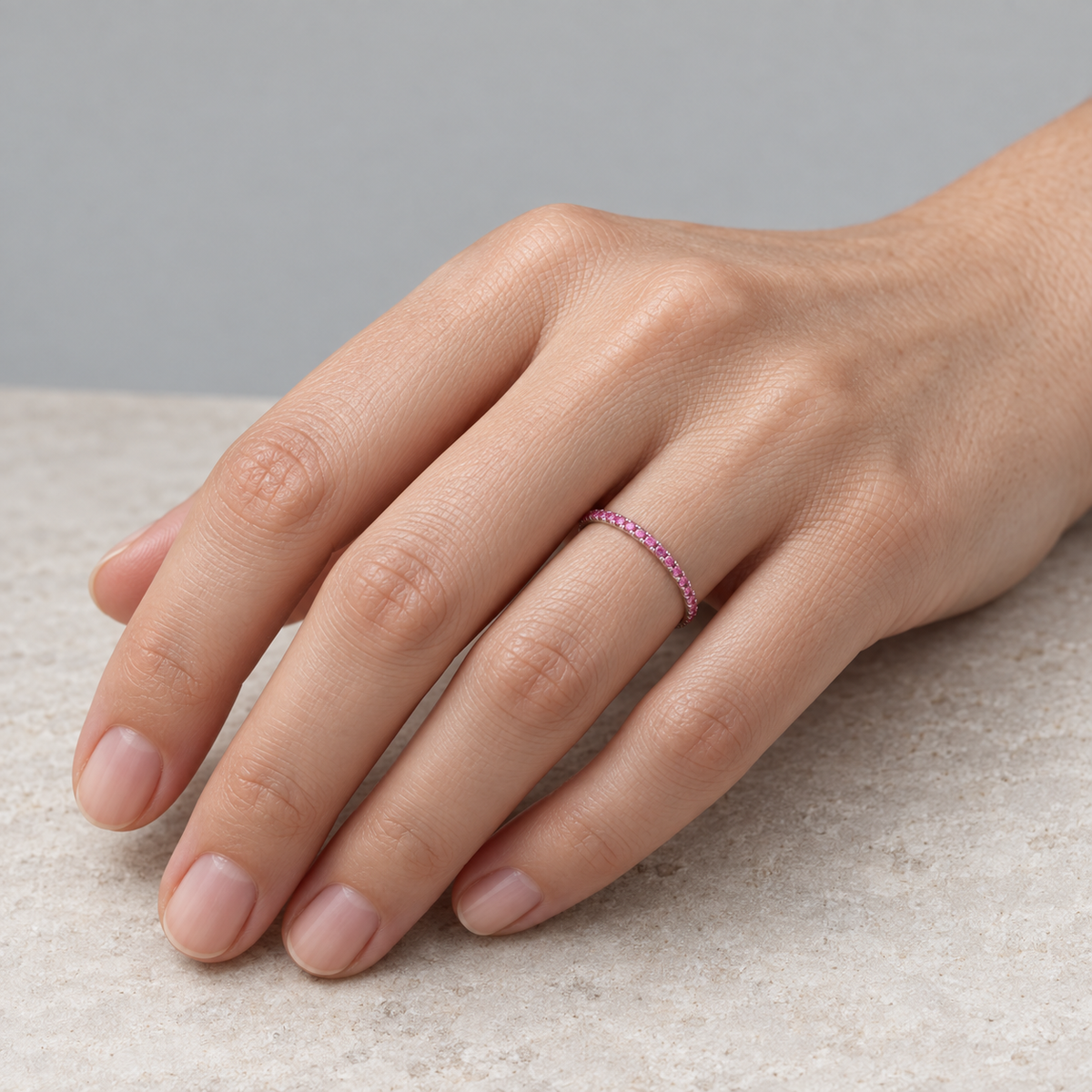 Model wearing the Lesunja White Gold Pink Sapphire Eternity Ring