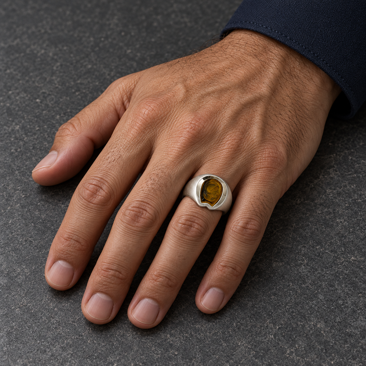 Model wearing the Lesunja Signet Ring Silver Tiger Eye
