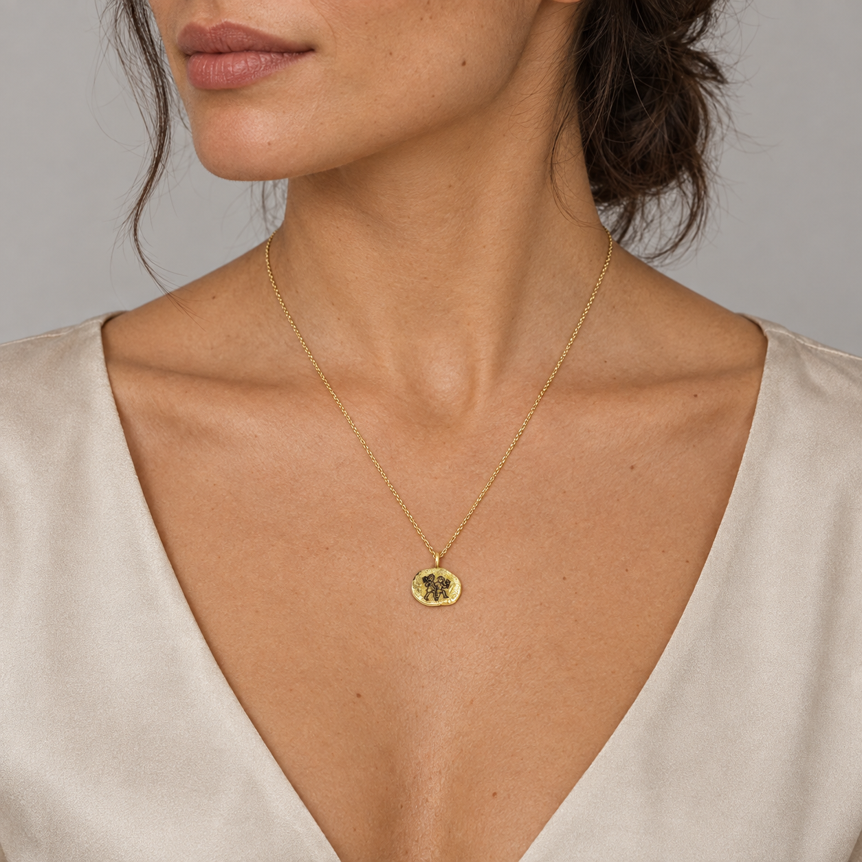 Model wearing the Lesunja Zodiac Gemini Yellow Gold Necklace