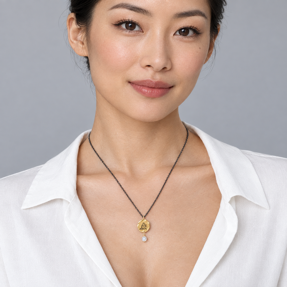 Model wearing the Lesunja Zodiac Aquarius Necklace Blackened Silver & Yellow Gold Moonstone