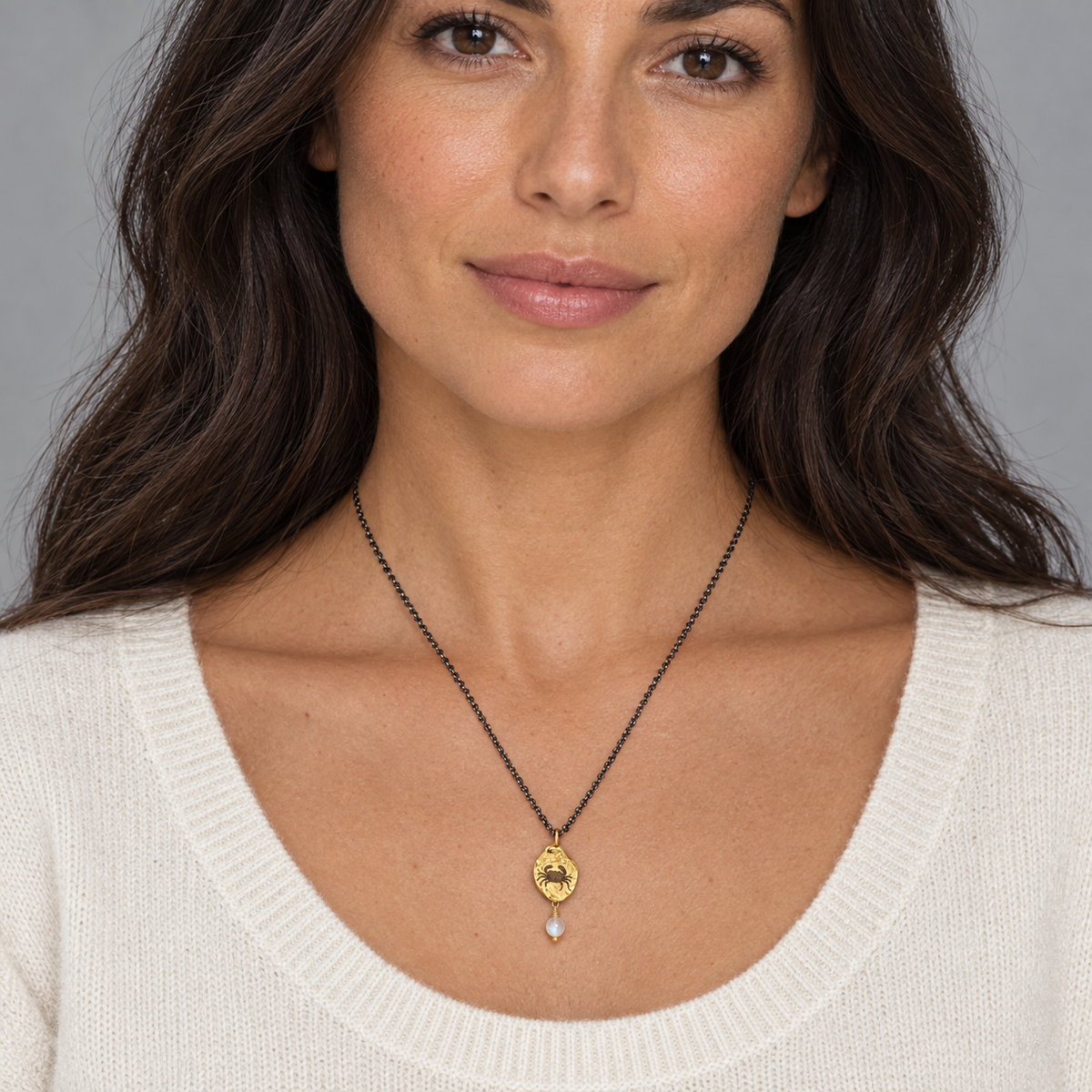 Model wearing the Lesunja Zodiac Cancer Silver Necklace Yellow Gold Nugget Moonstone