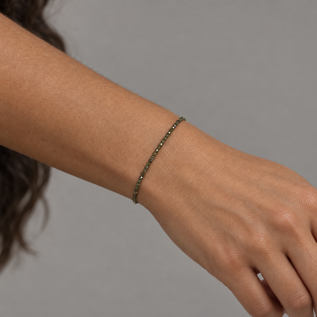 Model wearing the Lesunja Minute Of The Forest Olive Green Diamond Bracelet