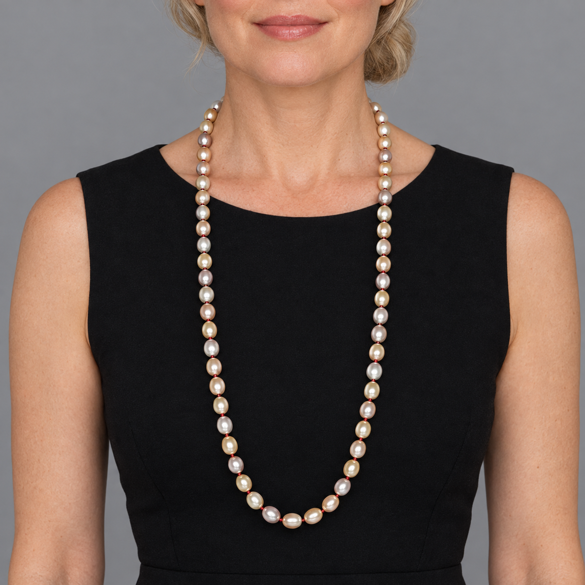 Model wearing the Lesunja Yellow Gold Light Orange & White Freshwater Cultured Pearl Necklaces