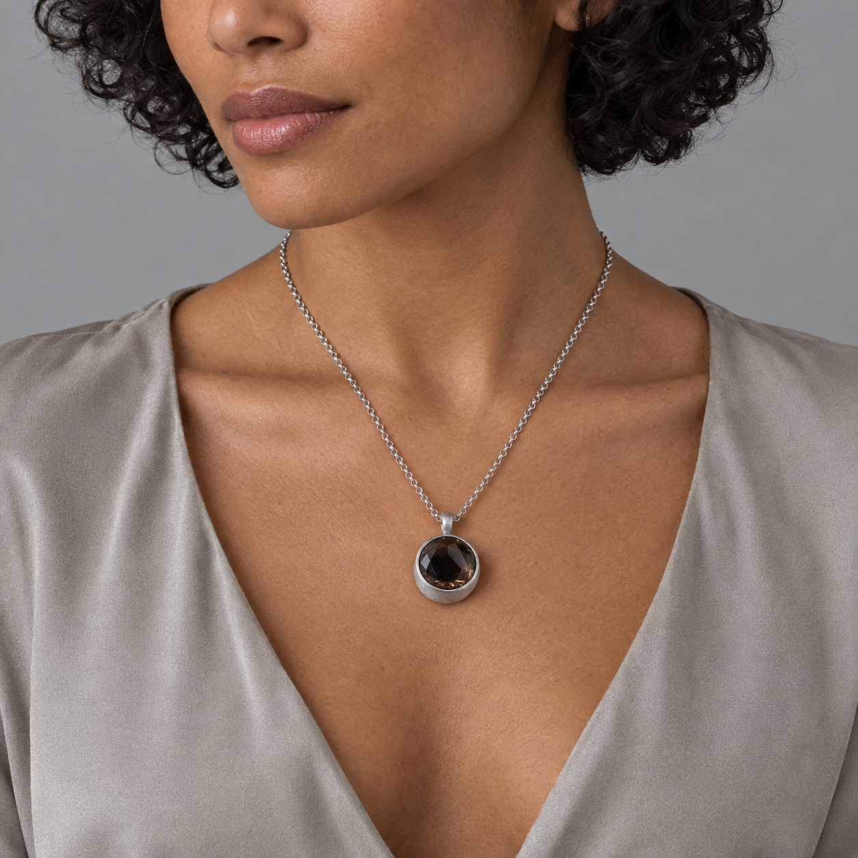 Model wearing the Lesunja Molecule Tina Smokey Quartz Silver Pendant