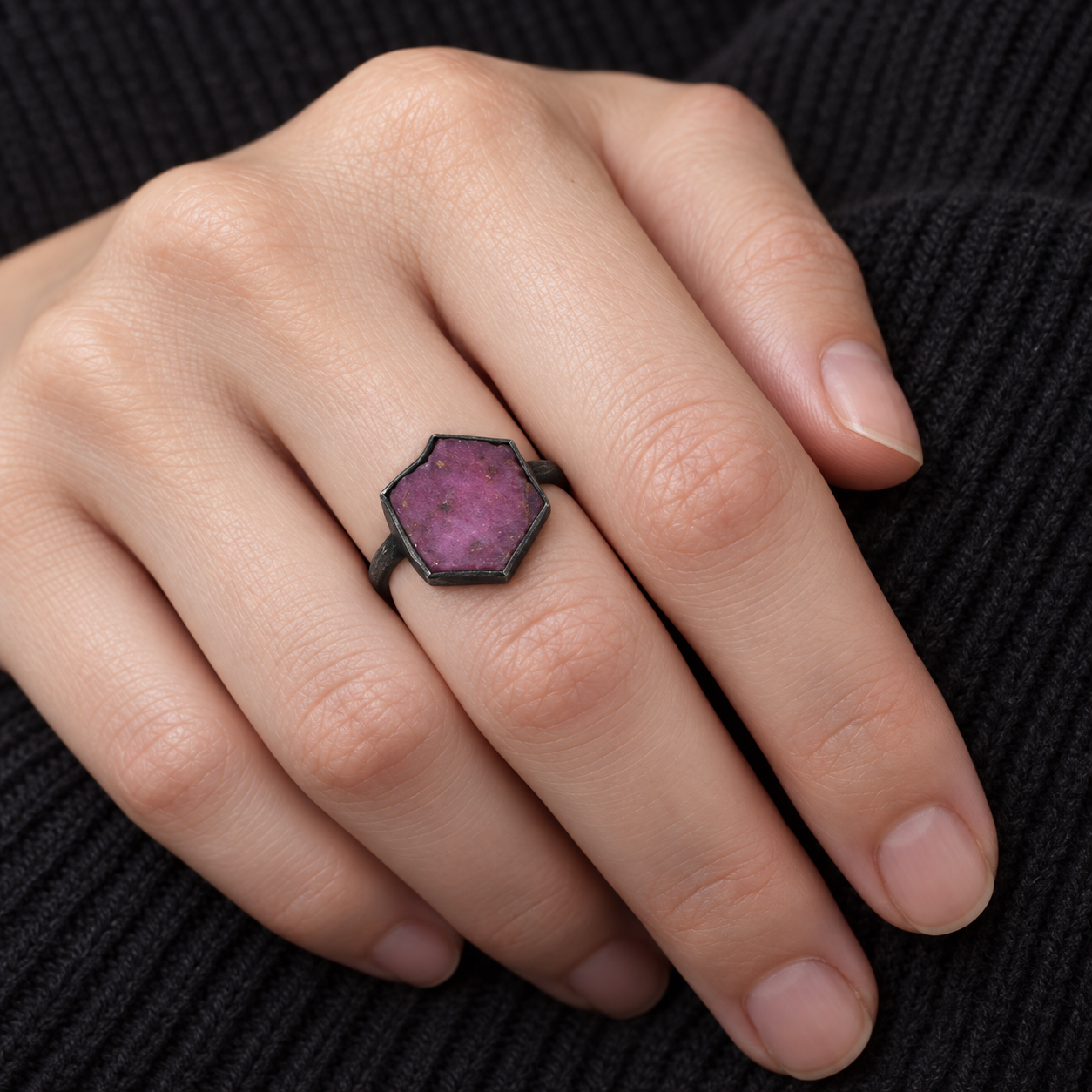Model wearing the Lesunja Sepia Blackened Silver Ring Raw Ruby