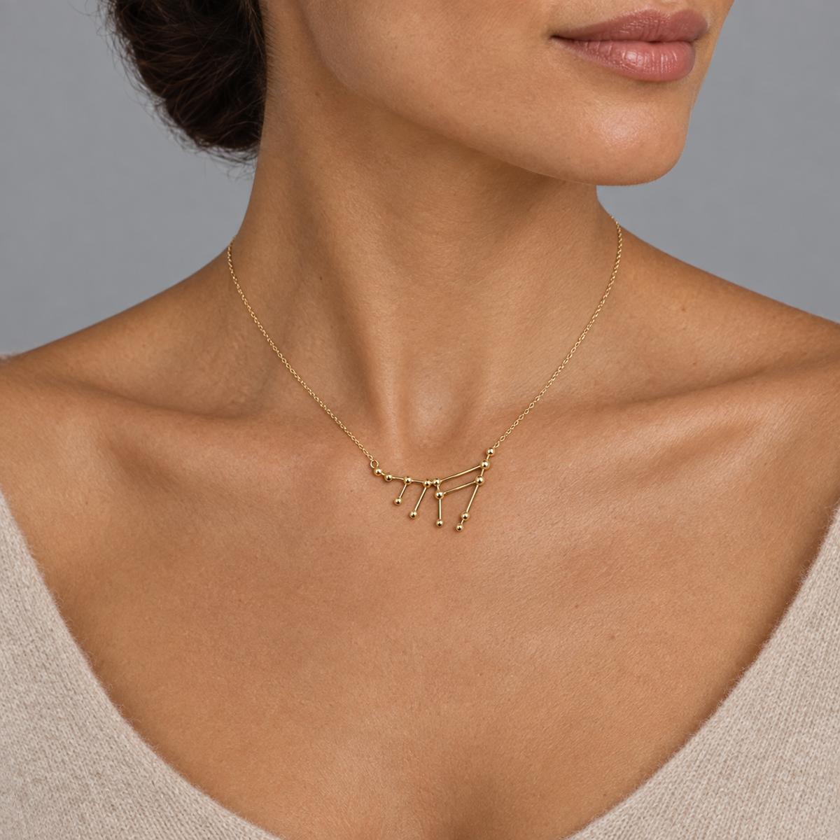 Model wearing the Lesunja Zodiac Capricorn Necklace Yellow Gold