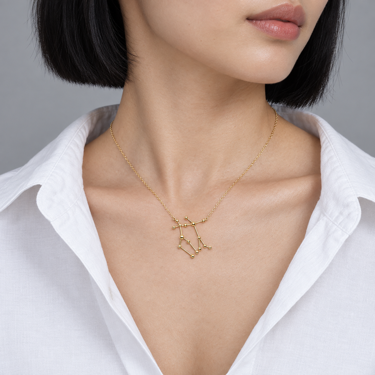 Model wearing the Lesunja Zodiac Gemini Necklace Yellow Gold