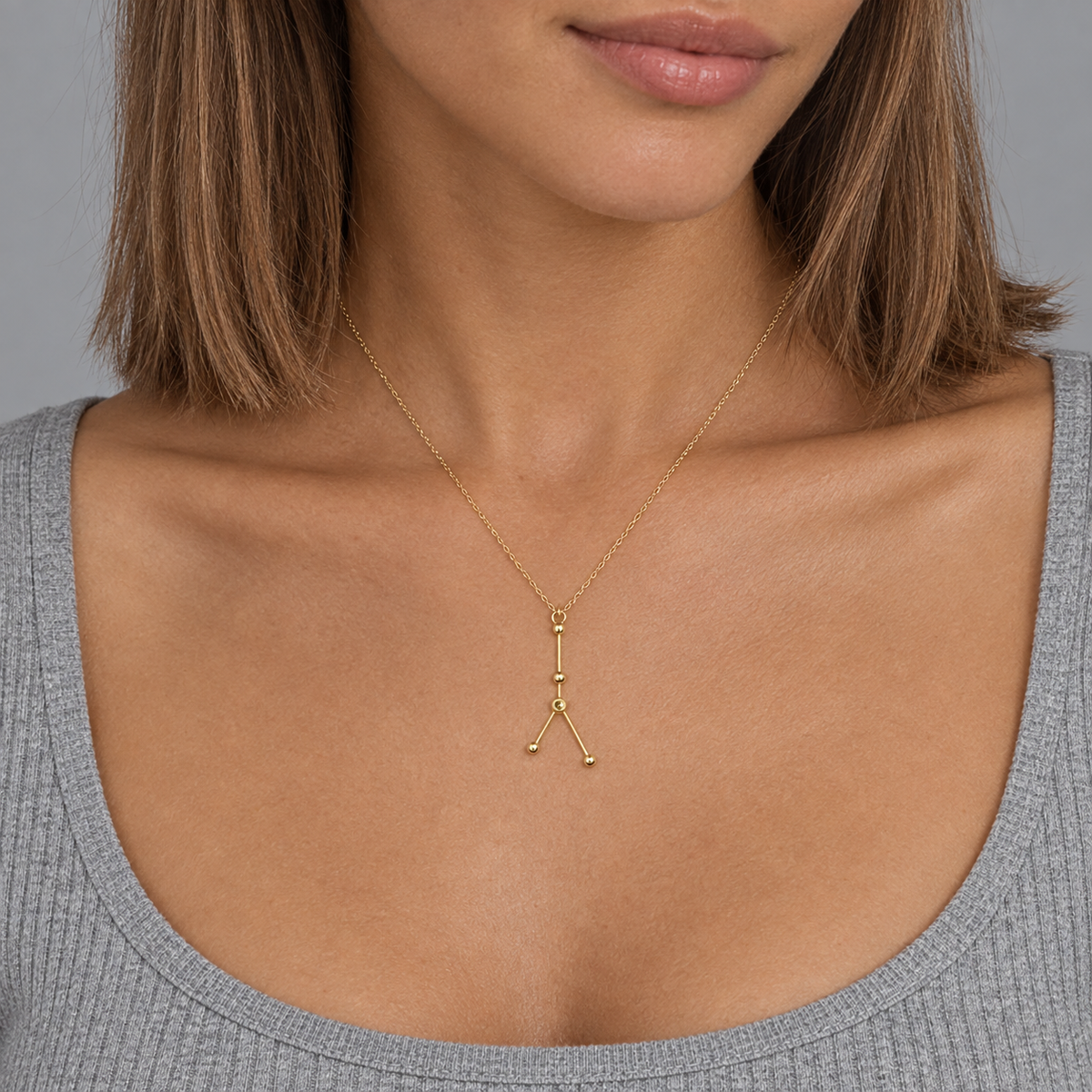 Model wearing the Lesunja Zodiac Cancer Necklace Yellow Gold