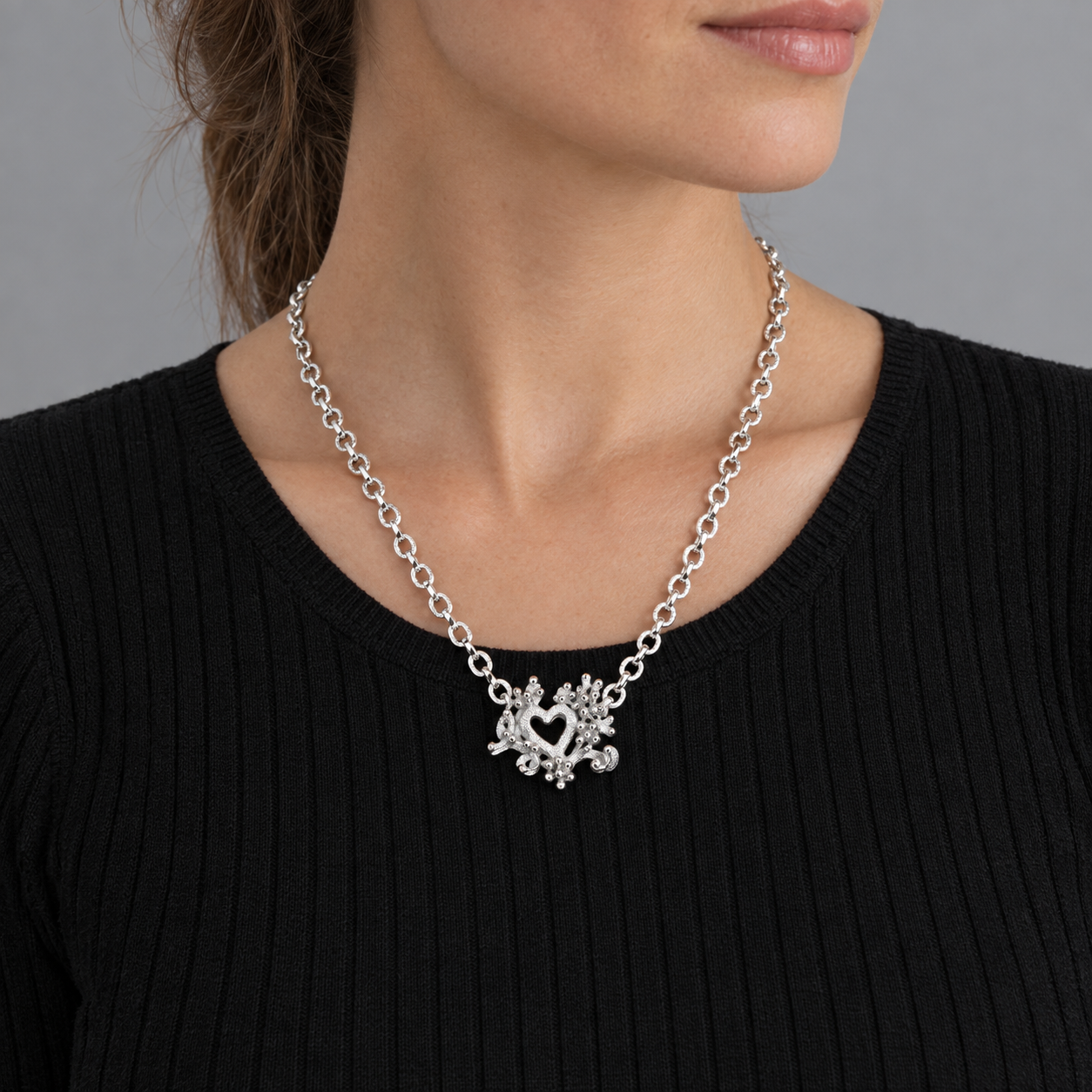 Model wearing the Lesunja Sepia Heart Silver Necklace