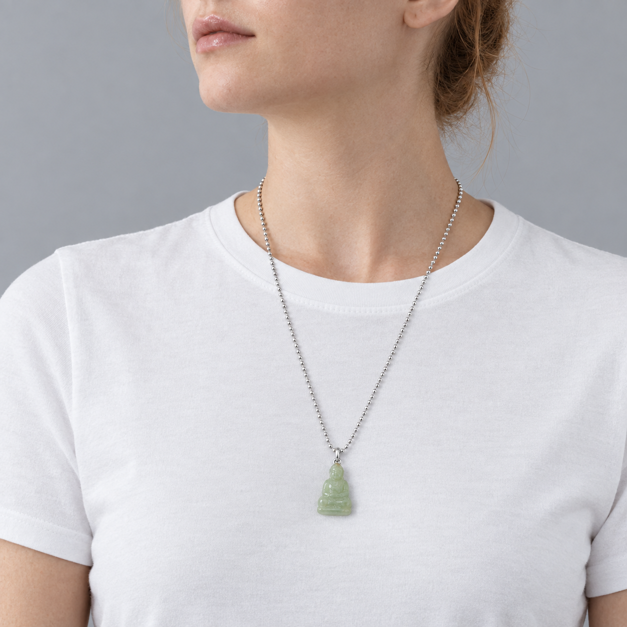 Model wearing the Lesunja Jade Buddha Pendant