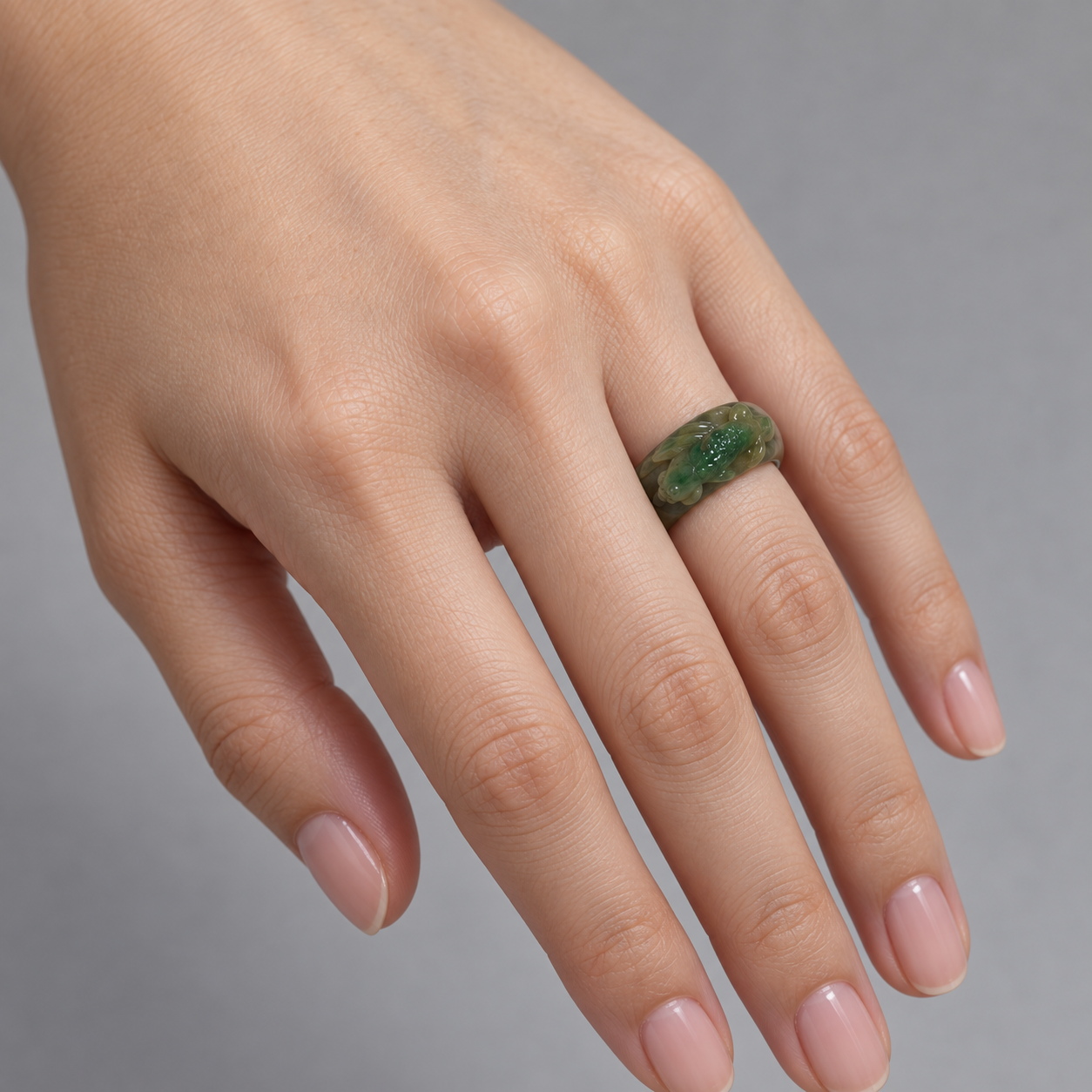 Model wearing the Lesunja Ring Green Jade Little koi carp
