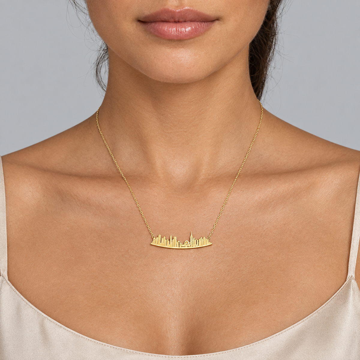 Model wearing the Lesunja Skyline New York Gold Plated Necklace
