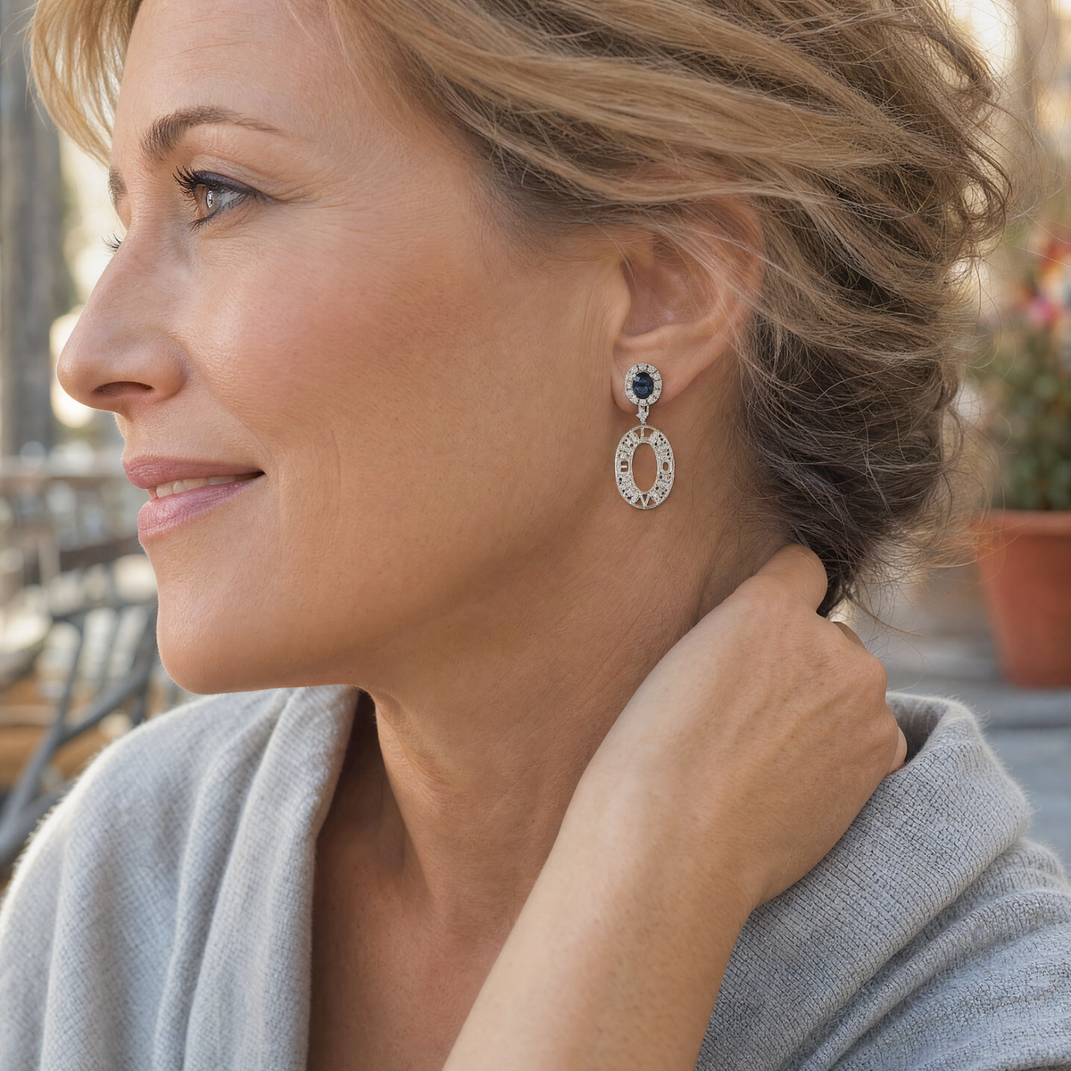 Model wearing the Lesunja Hidden Secrets Love Platinum Sapphire Earrings
