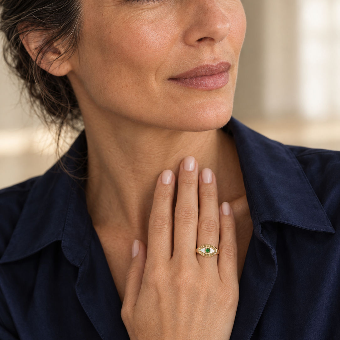 Model wearing the Lesunja Evil Eye Signet Ring Yellow Gold Green Garnet