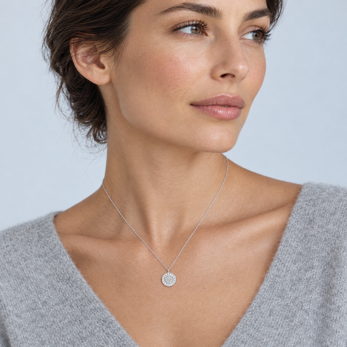 Model wearing the Lesunja St. Moritz Sun Necklace Small White Gold