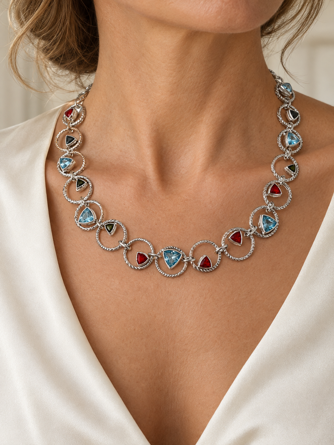 Woman wearing the Lesunja Sepia Silver Necklace Blue Topaz, Fire Opal & Tourmaline