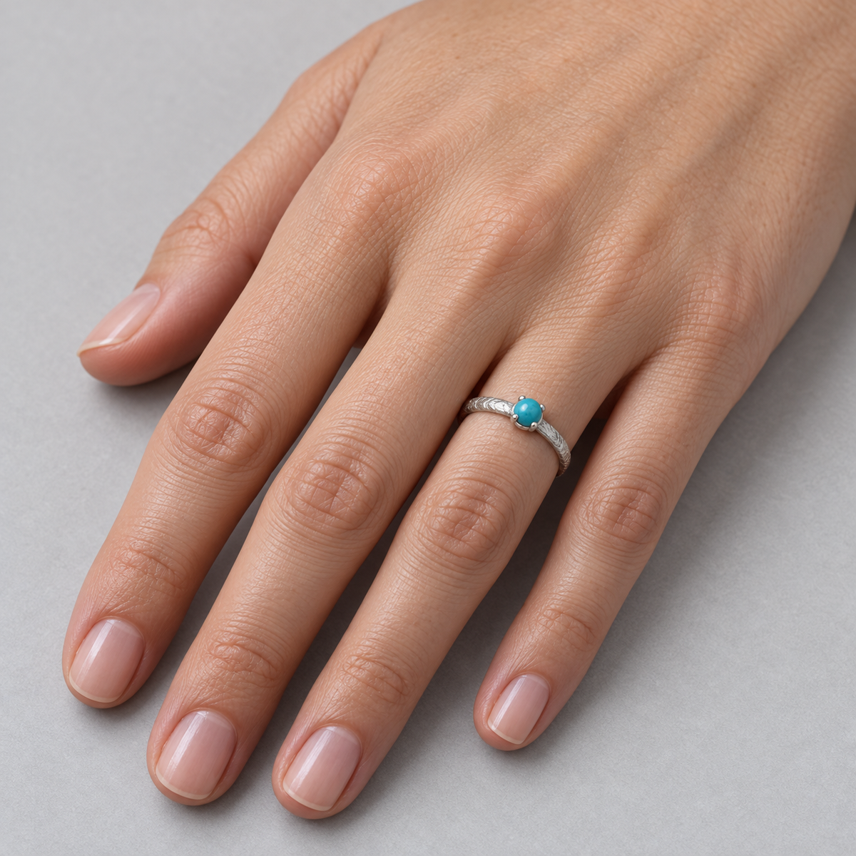 Model wearing the Lesunja Sepia Ring Solitaire Blue Turquoise