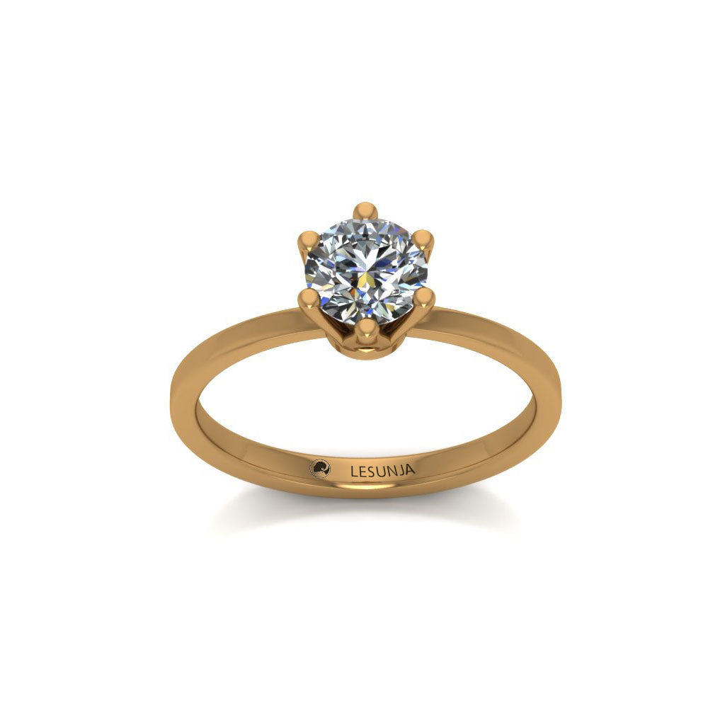 gold ring with red diamond