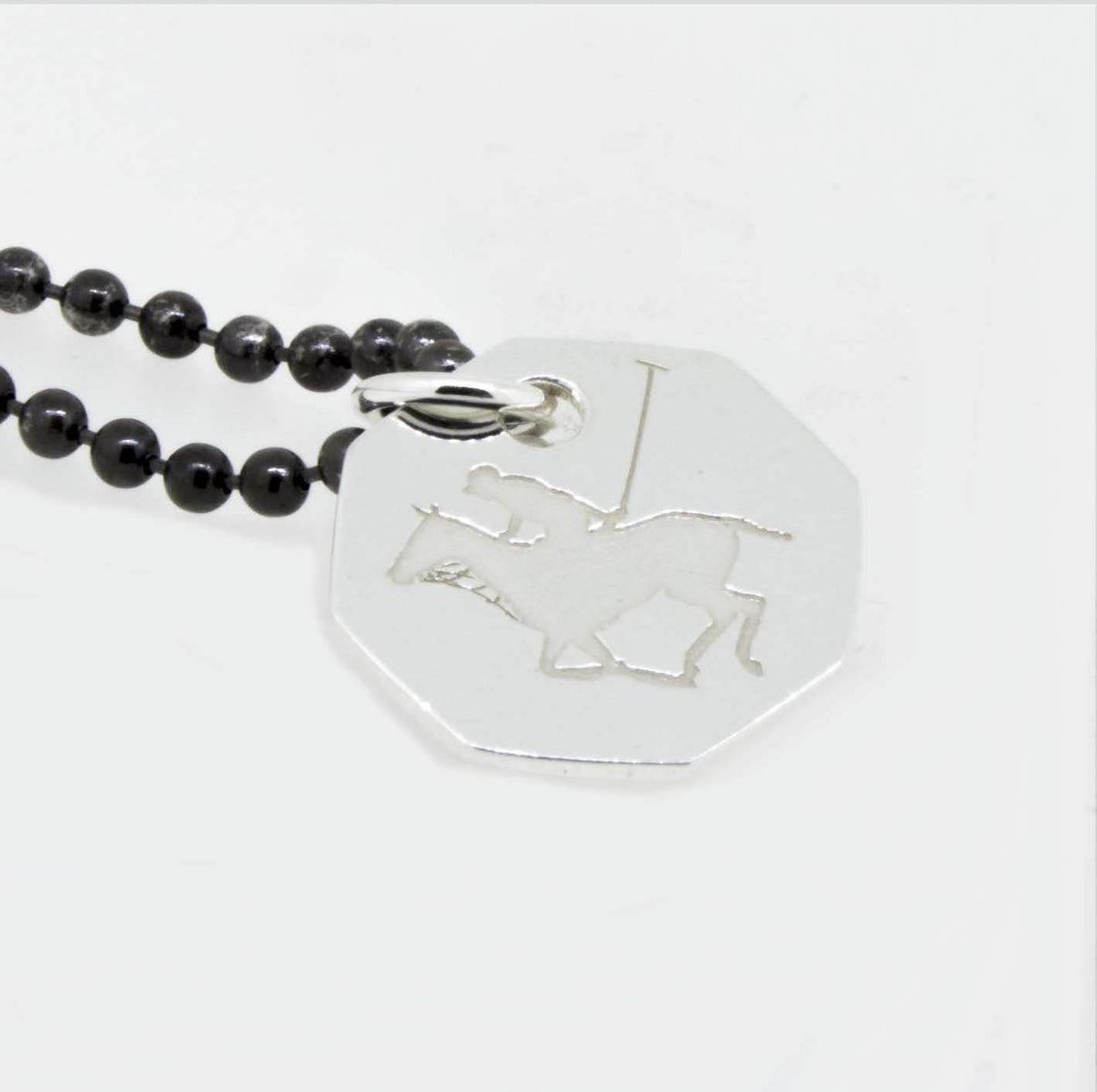 polo player necklace